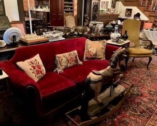 Vintage rocking horse, red velvet couch, multiple chess sets.