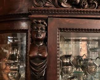 China cabinet has woman's bust on one side