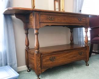 Vintage wooden buffet table, $17. Classic design makes it perfect for use as a sofa table, hallway accent, or entryway piece.