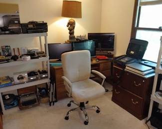 VR goggles, Remington typewriter, slide projector, HP printers, Canon printer, keyboards, monitor, HP Pavilion all-in-one computer, Bose radio, laptops (Dell, Toshiba, HP), office chair