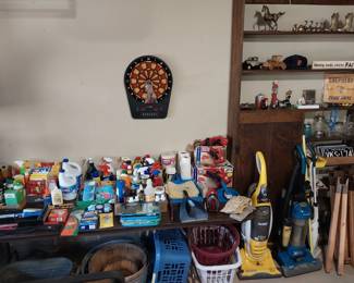 cleaning supplies, vacuums, license plates, baskets, garden chemicals, dart board