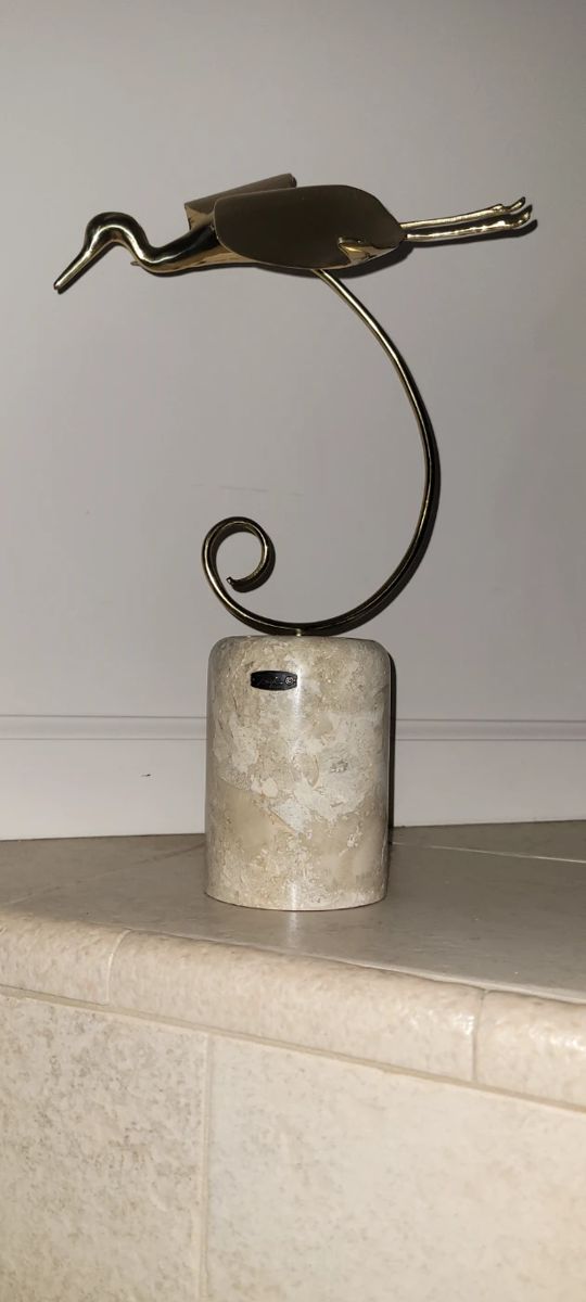 Bijan sculpture on marble base