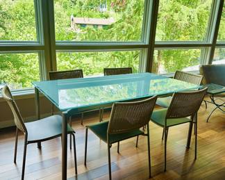 Calligaris Tempered Glass Expandable Table and Six Chairs. Table and Chairs sold separately.