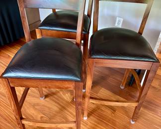 Leather seated stools in the style of Thomas Moser.