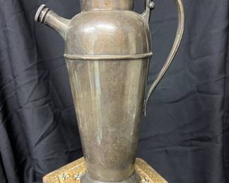 Antique metal pitcher.
