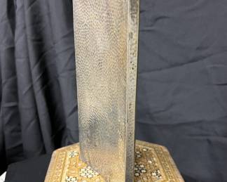 Hammered metal hip flask.