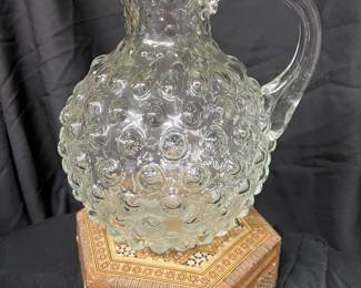 Unusual glass pitcher.
