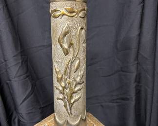 Bronze artillery shell art.