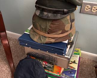 Vintage military helmets hats, board games
