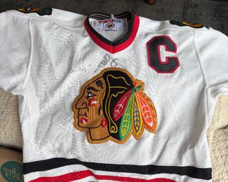 Child’s size signed autograph jersey black hawks