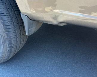 Minor body damage on rear passenger side fender