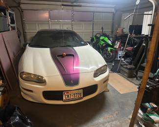 1999 Chevy Camero Z28
71,000 miles
Three-stage Pearl White with Chameleon Stripes