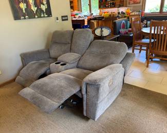 Here is the second upholstered (textured gray) electric reclining couch with console and cup holders in middle. Like-new and dangerously comfortable! Power headrest and recline too.