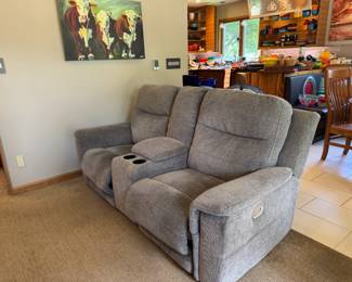 Here is the second upholstered (textured gray) electric reclining couch with console and cup holders in middle. Like-new and dangerously comfortable! Power headrest and recline too.