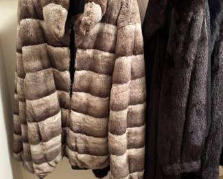 An OUTSTANDING fur coat collection, the best I've seen yet! Women's, mostly 2X, 1 3X and 1 XXL, coats range from long to short to a fox trim shawl. Purchased from all over the country, a collection of 7 coats total, with fur from around the world. All in mint condition
Chinchilla and leather reversible, short and
Black mink
