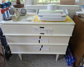 Great storage piece. I've got it holding 500 spools of thread, 100 rulers and 200 sewing notions no problem. Mid Century Modern design.