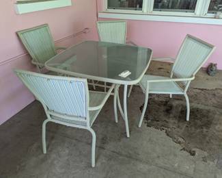 Frosted Glass Patio Table and 4 chairs kept in a screened in sunroom. Very nice condition.