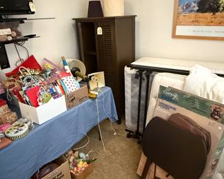Shuttered Wardrobe. Tray Set. Sleep Therapy Twin Beds, TV. Sewing items and Gift Wrap. Vintage wall lamps.