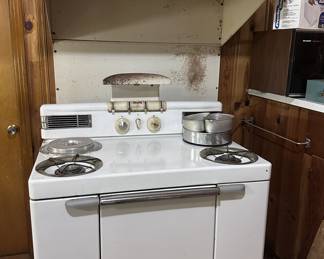 Maytag Dutch Oven Gas Range with Vent-a-hood. Likely from the 1949-1953 era.