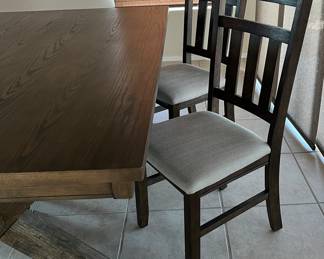 Dining Table 42 x 70 w 4 Chairs (the chairs look black, but they are not) They match the table