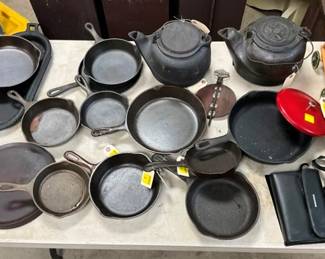 COLLECTION OF CAST IRON PANS