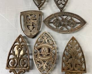 7 Cast Iron Trivets with Decorative Designs