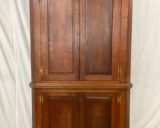 Two-Piece Corner Cabinet with Paneled Doors and Crown Top