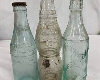 Embossed Soda Bottles: Whistle, New Icy, and Queen Cola