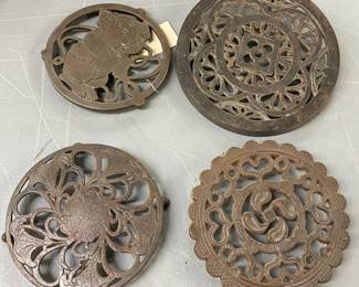 4 Cast Iron Trivets with Decorative Designs