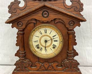 Wooden Mantel Clock with Architectural Design and Roman Numeral Dial