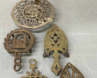 6 Cast Metal and Brass Decorative Trivets with Varied Motifs