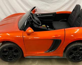 67” x 40” Electric Kids Porsche Toy Car in Orange with Black Trim