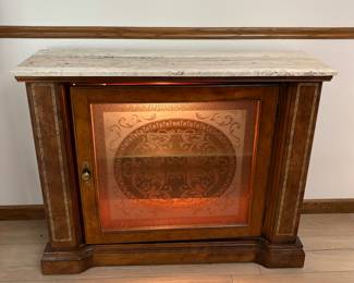 Small marble-top lit cabinet