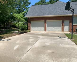 DRIVEWAY AND SIDEWALK RECENTLY PROFESSIONALLY PRESSURE WASHED.