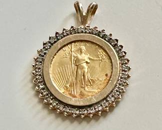 Gold and diamond bezel coin pendant 