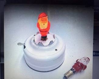 Milk glass blinking Santa light. Antique. https://modestlambestatesales.hibid.com/