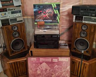 Lots of stereo equipment, cds, dvds, and cassettes