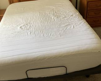 Queen size adjustable bed with Sealy cooling mattress.