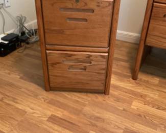 Wooden filing cabinet. Height 30 inches, width 20 inches, depth 24 1/2 inches.