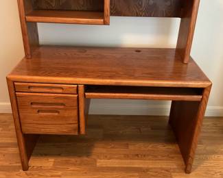 Desk with 2 drawers. Height 54 inches, width 49 inches, depth 26 inches.