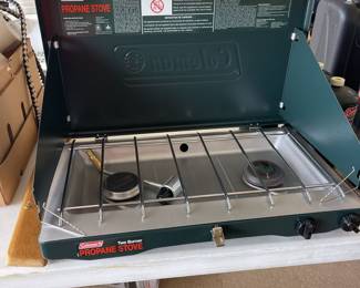 New never been used, with box Coleman stove.