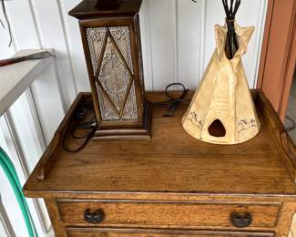 Western decor. Tepee light, desk with electrical outlet.