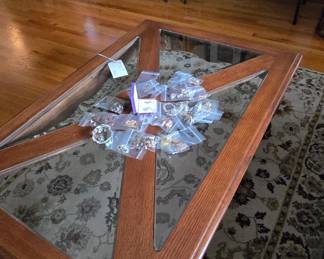 There is a little bit of jewelry on the coffee table.