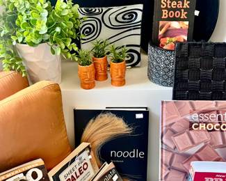 LOTS OF COOKBOOKS, ORANGES AND BLACKS.