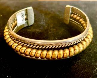 STELRING AND BRASS NAVAJO CUFF.
