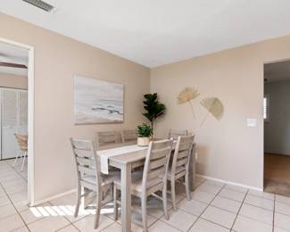 Dining room table and 6 chairs, artificial floor plant and table plant, decorative wall painting and wall art