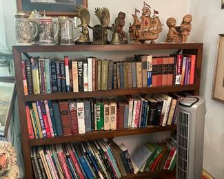 rare cast iron ship doorstop lamp on bookcase shelf