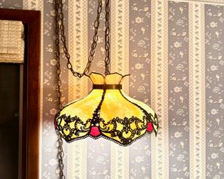 c.1900-1920, hanging slag lamp, handcrafted of cream and caramel colored stained glass. embossed decorated fillagree brass banding and decorative edging, approx 20" x 12"
