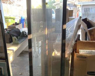 It is tricky to see in the available light, but this could be a corner display case.