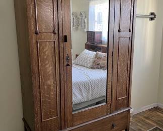 Here is a lovely armoire with a mirror. Come by to see it for yourself.